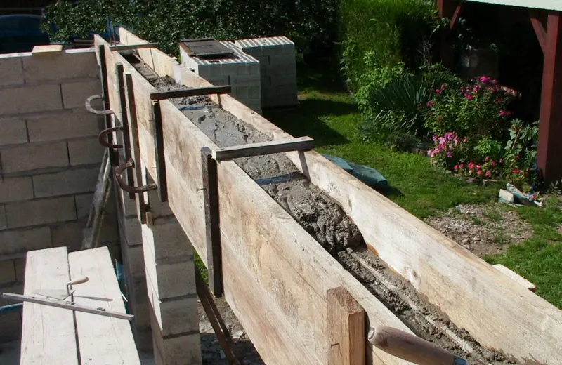 Timber shuttering around concrete masonry